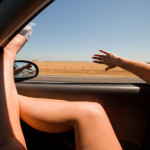Girl Sticking Her Hands and Feet Out of the Window