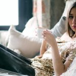 woman books bed