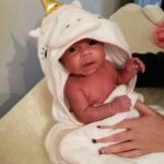 Baby in a unicorn towel