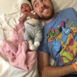 Dad next to smiling baby