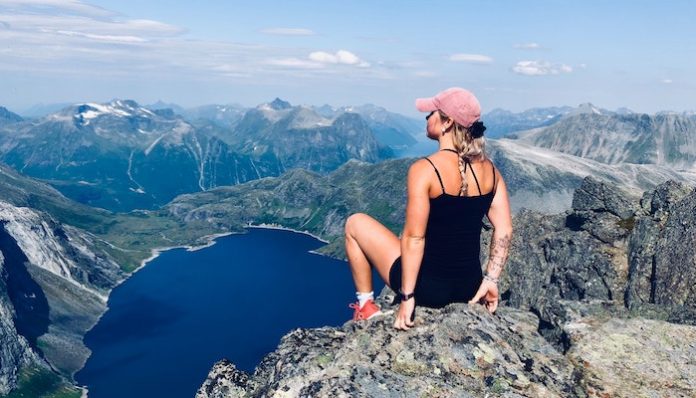 girl wearing fitbit on mountain