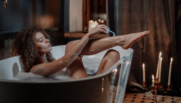 woman-in-bathtub-with-water-4156336