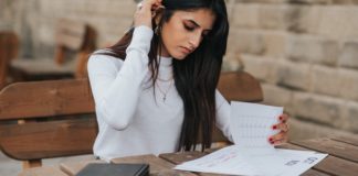 How To Create A Vision Board For 2021 That Actually Works woman-making-vision-board-success