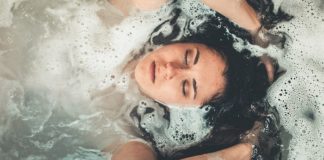 Why You Should Add CBD Bath Bombs To Your Next Amazon Order woman-using-cbd-bath-bomb
