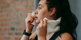 13 Possible Reasons You May Feel Hot Or Sweat All The Time woman-sweating-hot