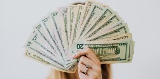 5 Easy Ways To Start Saving More Money person-holding-money