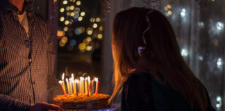The History Behind 3 Classic Birthday Traditions woman-blowing-candles-birthday