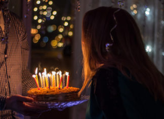 woman-blowing-candles-birthday