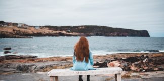 grieving woman on bench