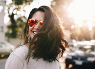 woman smiling sunglasses
