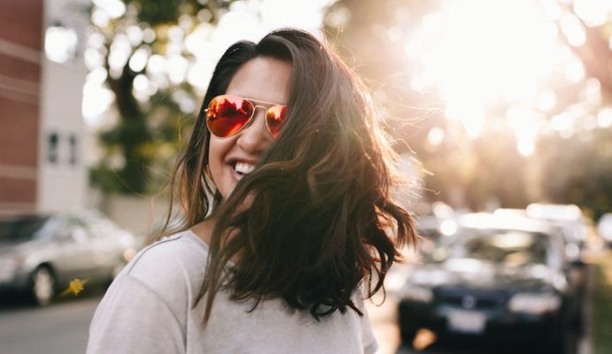 woman smiling sunglasses