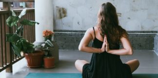 5 Tips For Living A More Mindful Life woman doing yoga and mindfulness