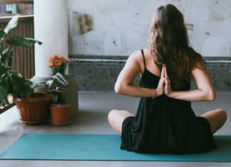 5 Tips For Living A More Mindful Life woman doing yoga and mindfulness