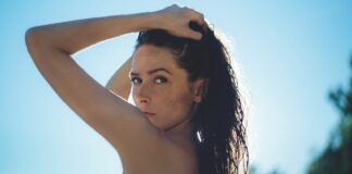 5 Essential Things To Add To Your Daily Routine This Summer woman in summer clear skin