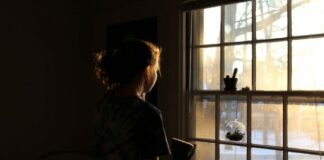 5 Tips For Healing From Your Childhood Trauma lonely woman standing by window
