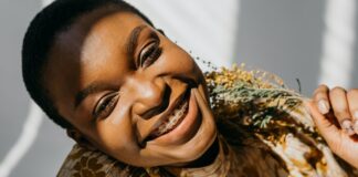 Your Guide to Braces vs. Invisalign woman-wearing-braces