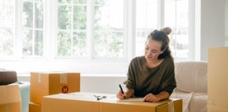 Why I’m Moving Back Into an Apartment After Living In a House woman-in-apartment