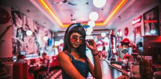 Woman Checking Out Retro Diner