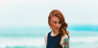 Which Tattoo Style Best Fits Your Personality Woman With Tattoo On Arm