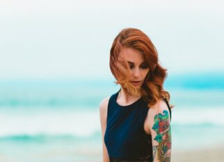 Woman With Tattoo On Arm