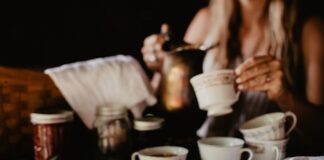 9 Herbs That Will Give You An Energy Boost Woman Making Tea With Herbs Natural Energy