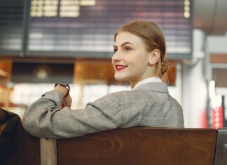 Woman Playing Crossword Puzzle in Airport Before Flight