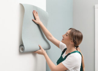 Girl Hanging Wallpaper Accent Wall