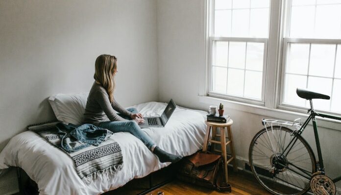 pexels-andrew-neel-3954635 woman changing bedroom decor