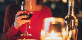 A Beginner’s Guide To Becoming A Red Wine Connoisseur woman drinking red wine
