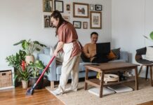 Woman Using Cordless Vacuum