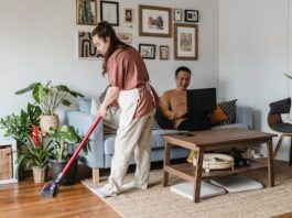 Woman Using Cordless Vacuum