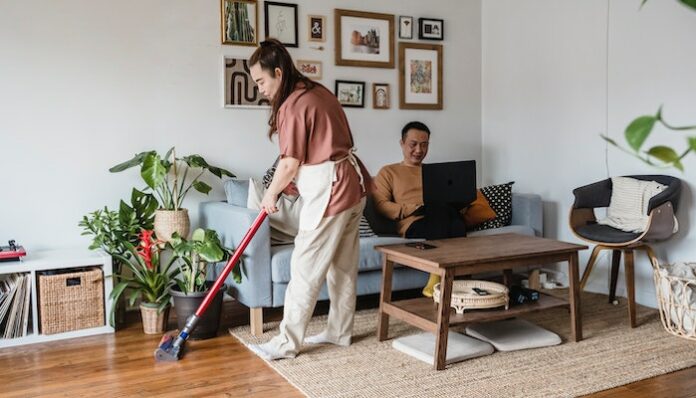 Woman Using Cordless Vacuum