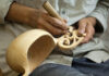 Man Performing Wood Carving and Engraving