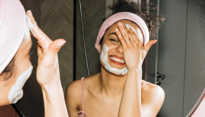 Woman Applying Skincare Products
