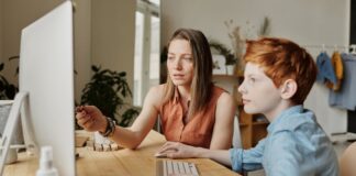 Mom and Son Making Digital Journal of Teen Years