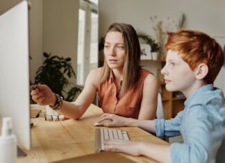 Mom and Son Making Digital Journal of Teen Years
