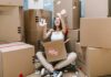 Why Hiring A Top-Notch Moving Company Will Remove Your Moving Stress Woman Packing for Movers