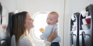 Woman Traveling With Baby and Essentials