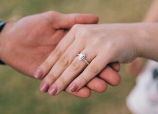 5 Tips for Properly Cleaning Your Engagement Ring Couple Showing Off Engagement Ring