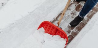 Woman Clearing Snow Without Snow Plowing Service