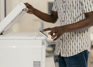 Staff Member Using Fax Machine