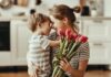 Woman Receiving Mother's Day Flowers from Son
