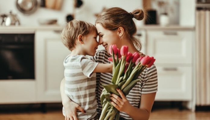 Flowers for Mother's Day Woman Receiving Mother's Day Flowers from Son