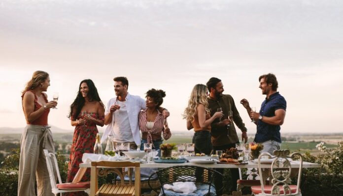 Outdoor Party Group of Friends Having Outdoor Party With Smoked Meats