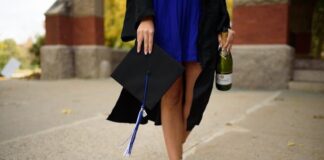 Woman Holding Cap and Champagne After Graduating College