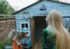 Women Using Tool Storage Shed for Backyard Gardening