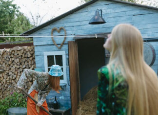 Women Using Tool Storage Shed for Backyard Gardening