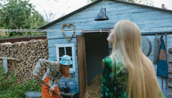 pexels-yaroslav-shuraev-8889706 Women Using Tool Storage Shed for Backyard Gardening