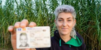 Woman holding drivers license