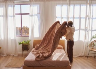 Woman making her bed